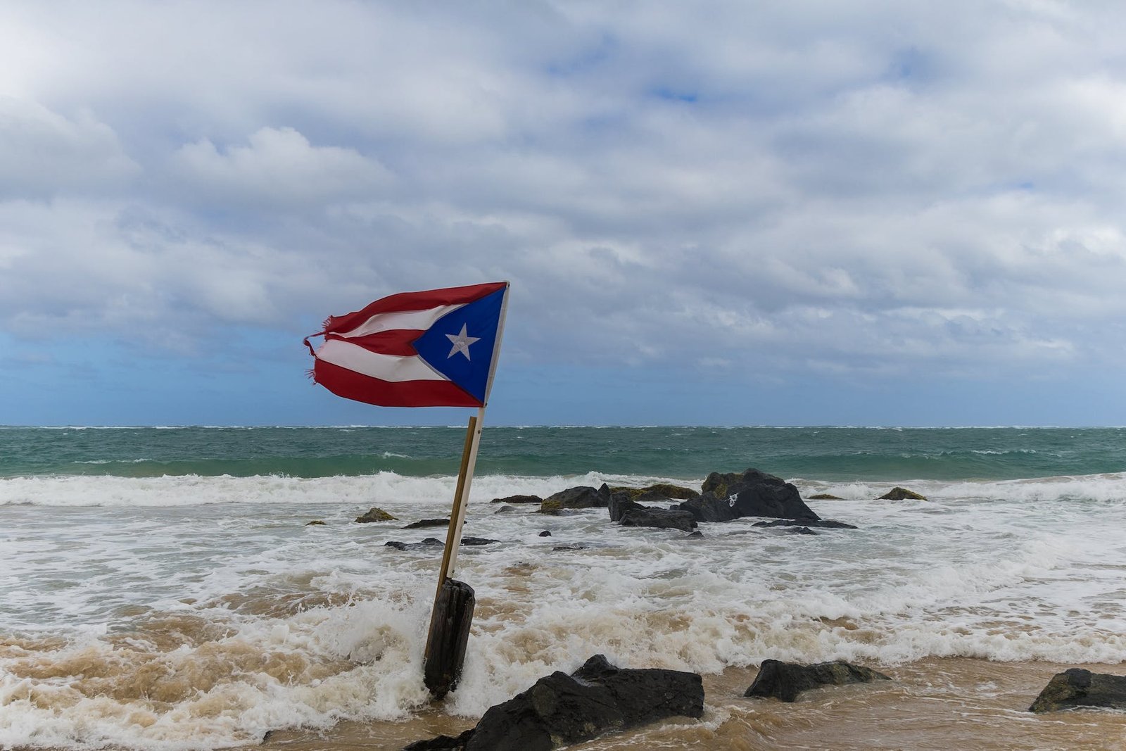 flag of puerto rico on sea shore
